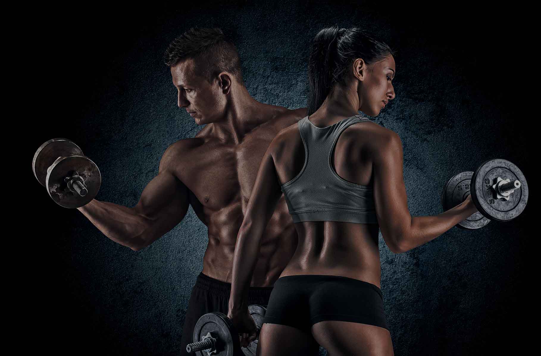 Athletes lifting dumbbells