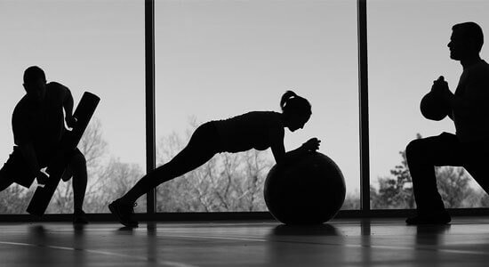 Athletes training with a medicine ball